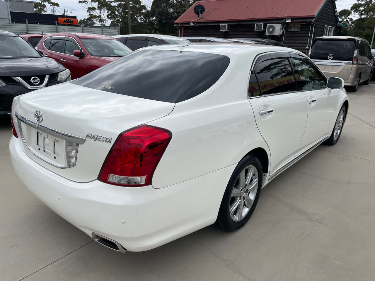 2012 Toyota Crown Majesta V8 4.6L C Type Luxury Sedan rear view showcasing sleek design and modern features.