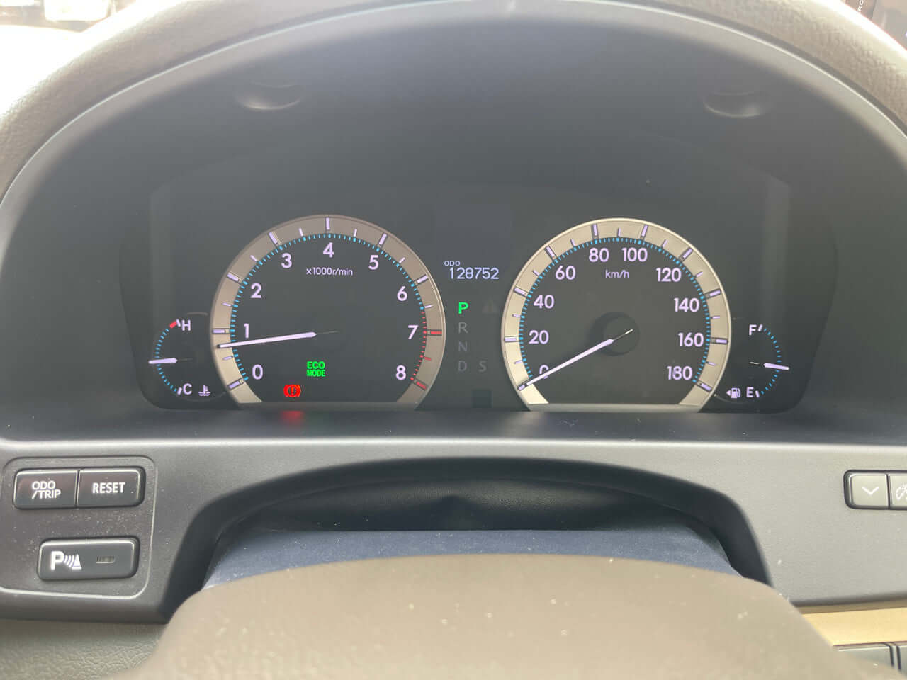 Dashboard of a 2012 Toyota Crown Majesta V8 4.6L showing speed, RPM and mileage at 128752 km.