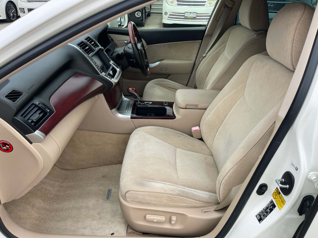 Interior view of the 2012 Toyota Crown Majesta V8 4.6L C Type Luxury Sedan, showcasing leather seats and advanced dashboard.
