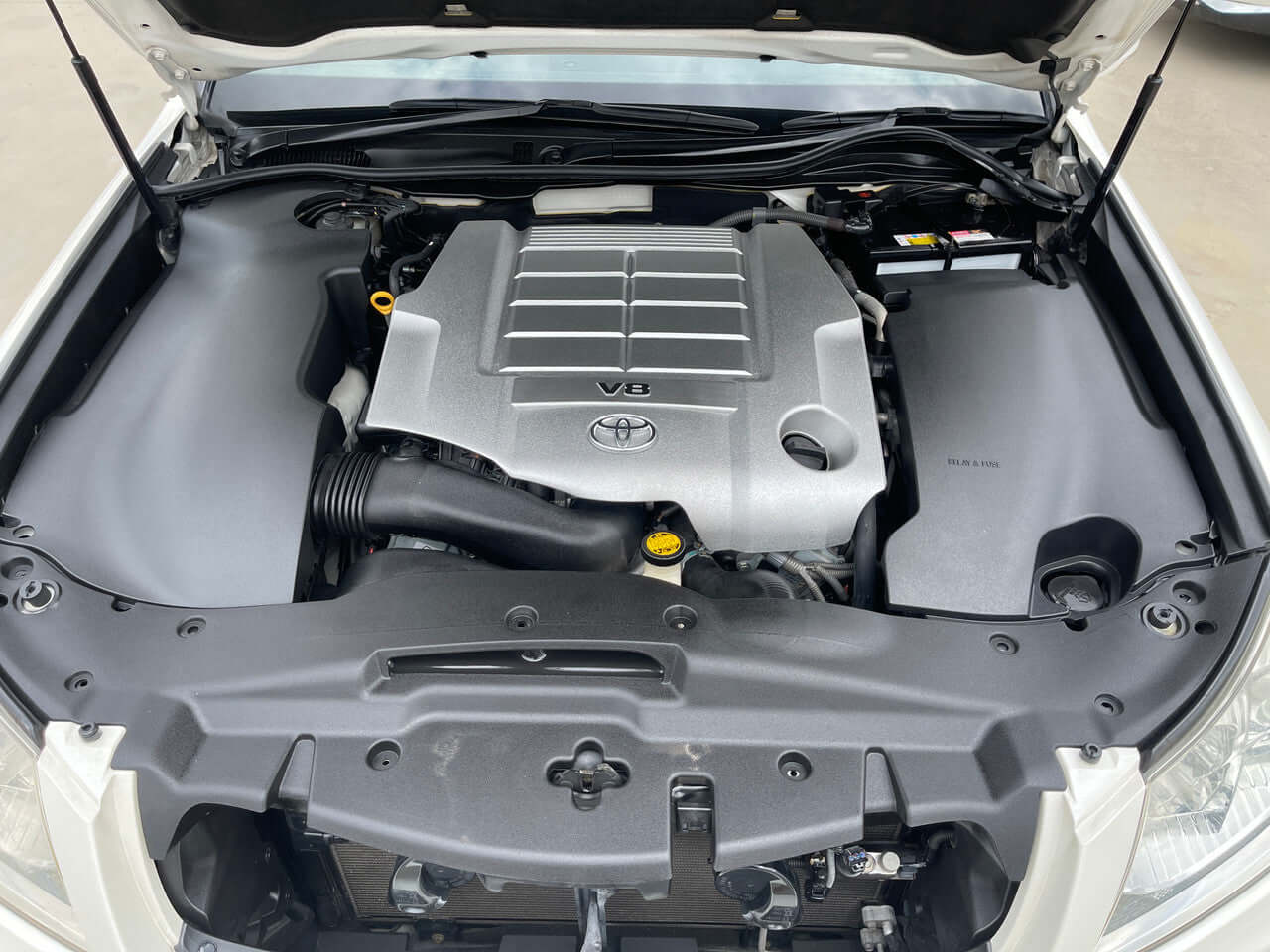 2012 Toyota Crown Majesta V8 4.6L engine compartment showcasing the V8 engine and components.