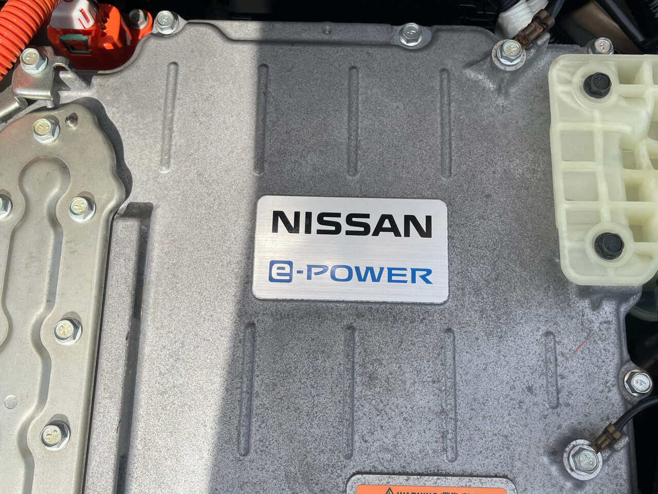 2017 Nissan Note e-Power Medalist Edition Close-up of the Nissan e-Power engine component showcasing the branding and design.
