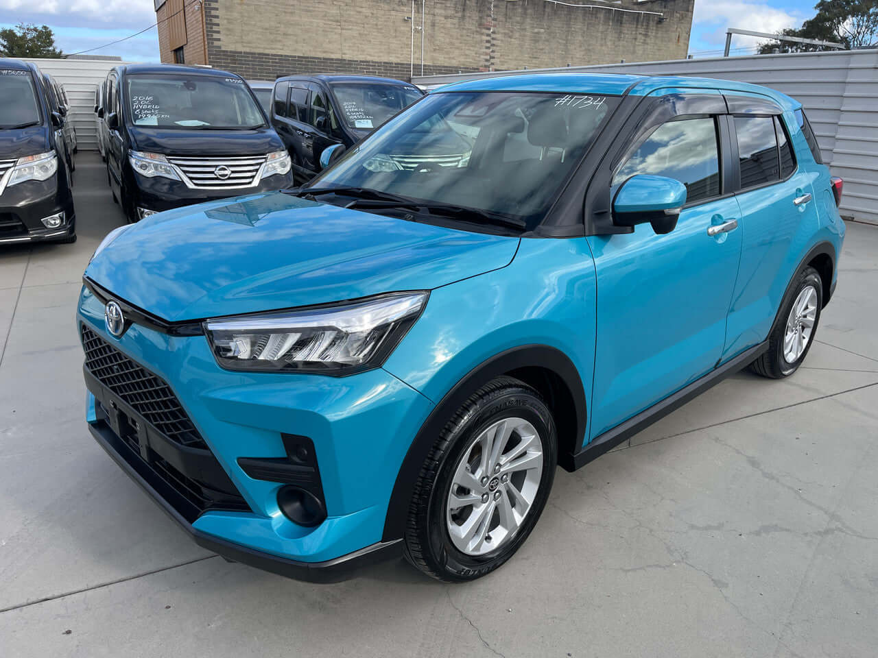 2022 Toyota Raize 1.2L e-Smart Hybrid compact SUV in blue, showcasing modern design and features.