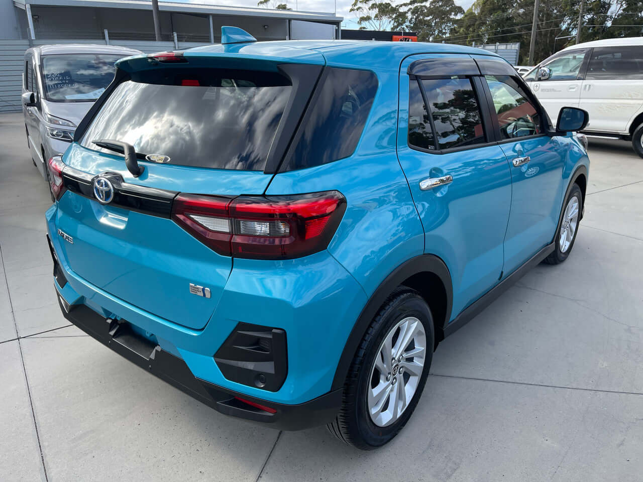 2022 Toyota Raize 1.2L e-Smart Hybrid G compact SUV in blue color, showcasing rear design and sporty features.