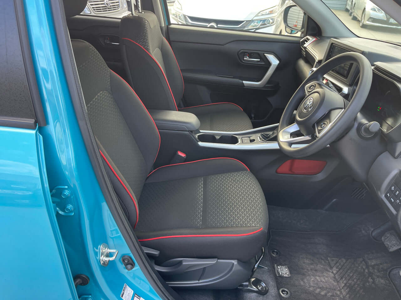 Interior view of the 2022 Toyota Raize 1.2L e-Smart Hybrid showing front seats and dashboard.