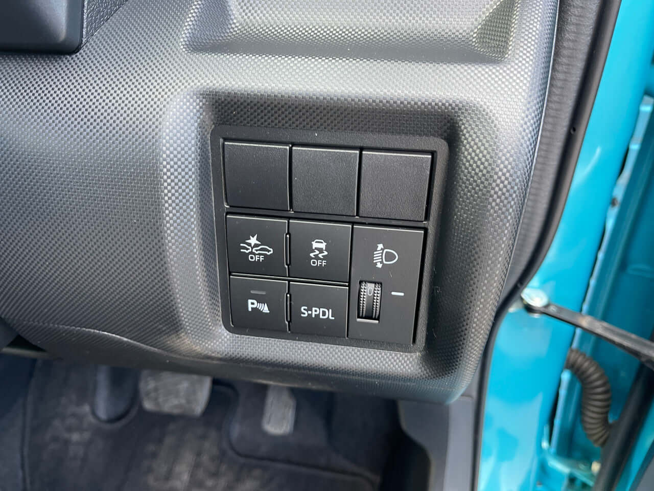 Controls and buttons on the dashboard of a 2022 Toyota Raize 1.2L e-Smart Hybrid SUV.