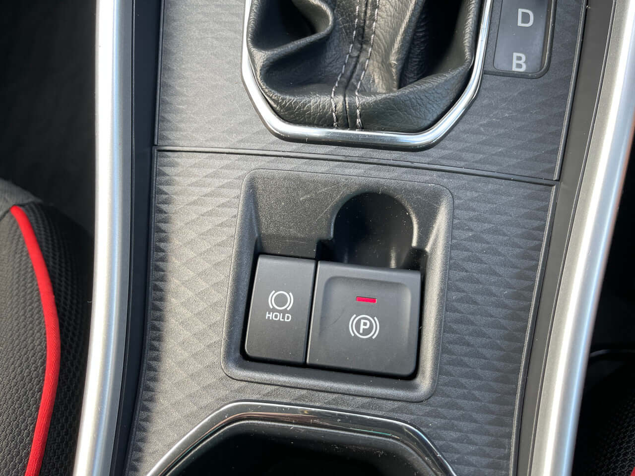 Interior controls of the 2022 Toyota Raize 1.2L e-Smart Hybrid G showing parking assist and hold buttons.