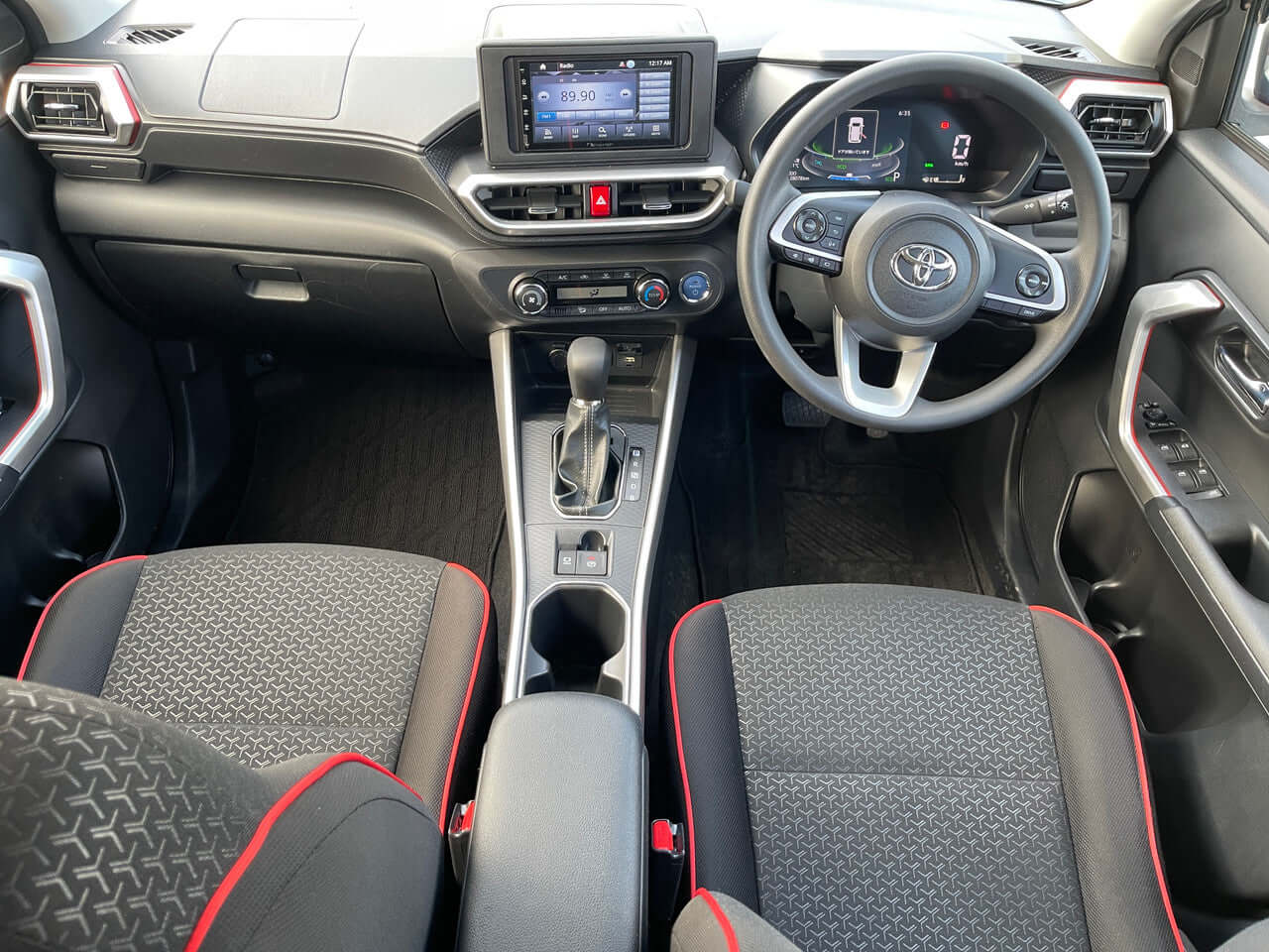 Interior view of the 2022 Toyota Raize 1.2L e-Smart Hybrid featuring comfortable seating and advanced dashboard.