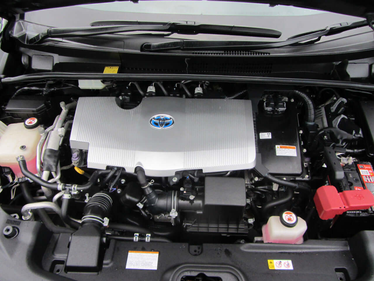 2017 Toyota Prius Prime Plug-In Hybrid 1.8L engine compartment view with Toyota logo and components.