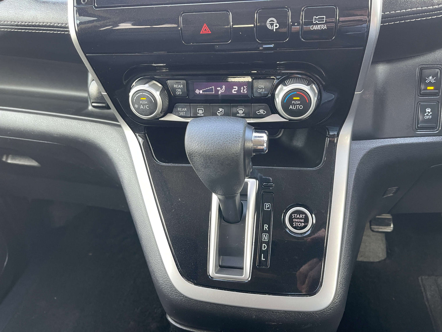 Interior dashboard of a 2017 Nissan Serena 2.0L S-Hybrid featuring controls and gear shifter.