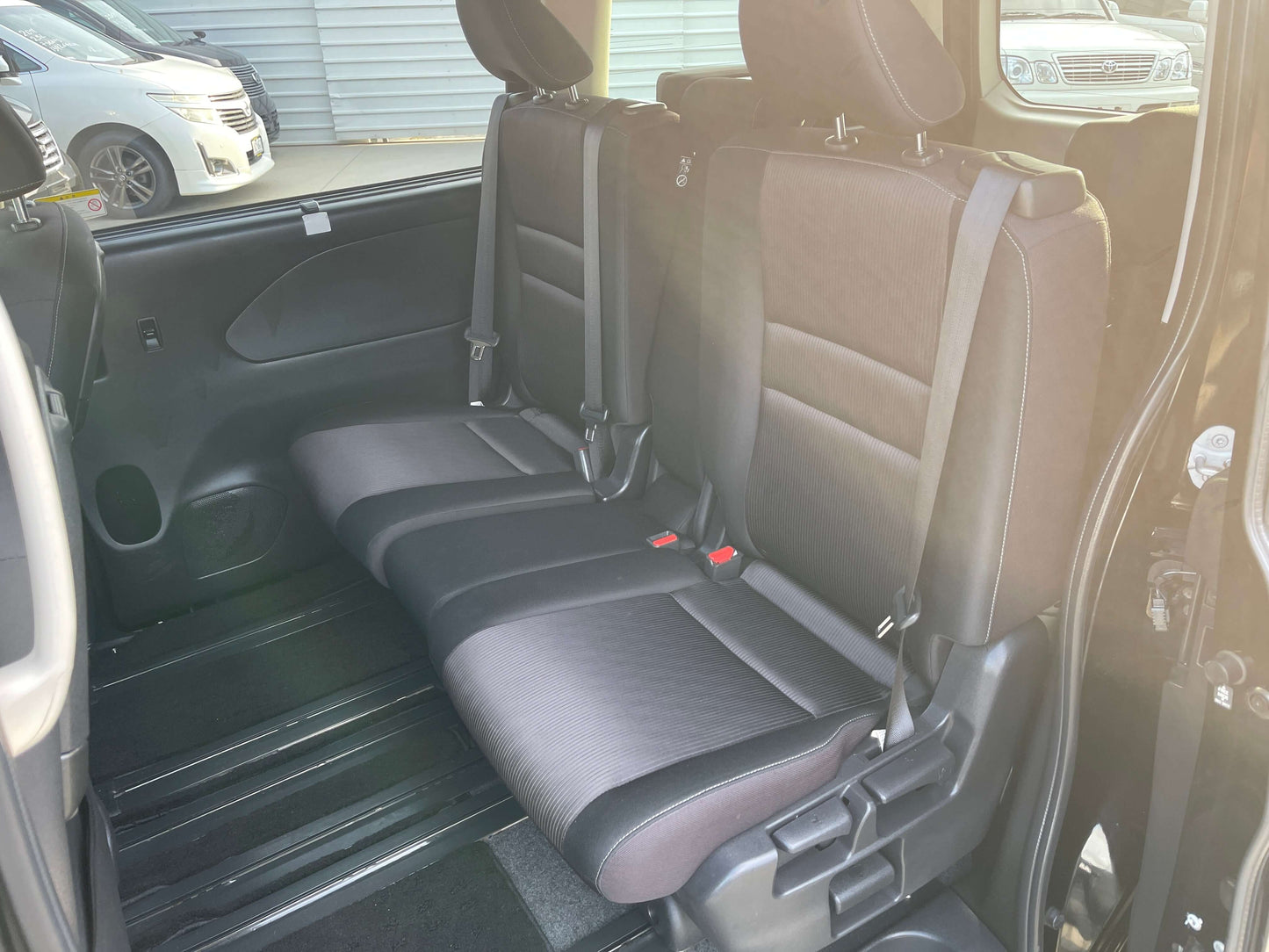 Interior rear seats of 2017 Nissan Serena 2.0L S-Hybrid, spacious seating for 8 passengers.