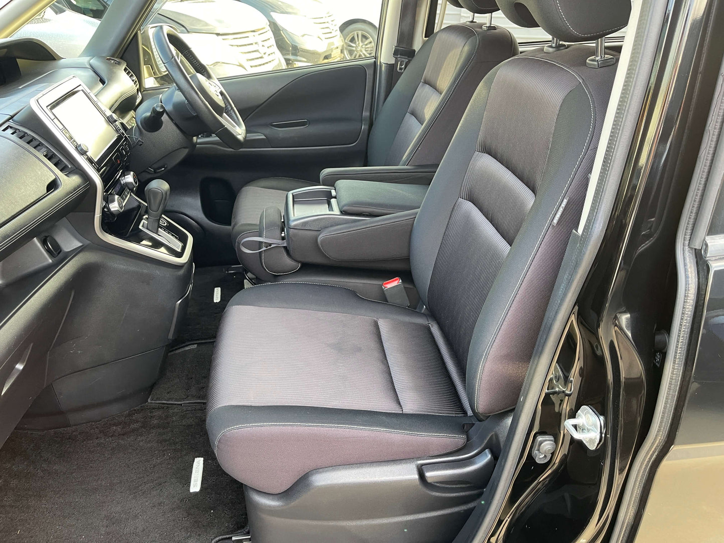 Interior view of the 2017 Nissan Serena 2.0L S-Hybrid with comfortable seating and modern dashboard features.