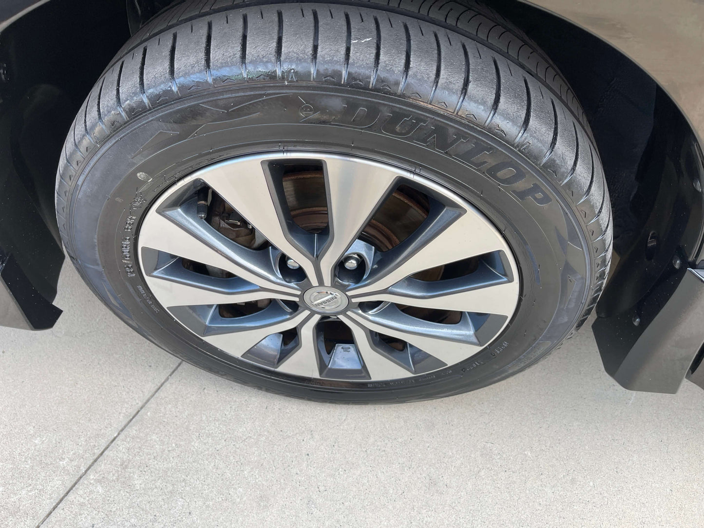Close-up of a 2017 Nissan Serena 2.0L S-Hybrid Highway Star wheel and tire showcasing stylish alloy rim and Dunlop tire.