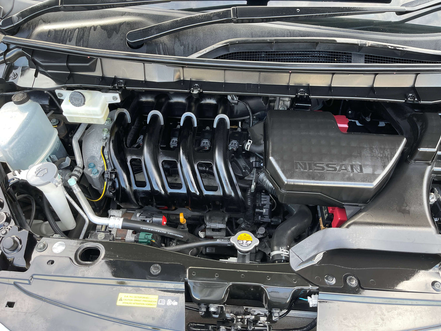 2017 Nissan Serena 2.0L S-Hybrid engine view, showcasing the internal components and Nissan branding.