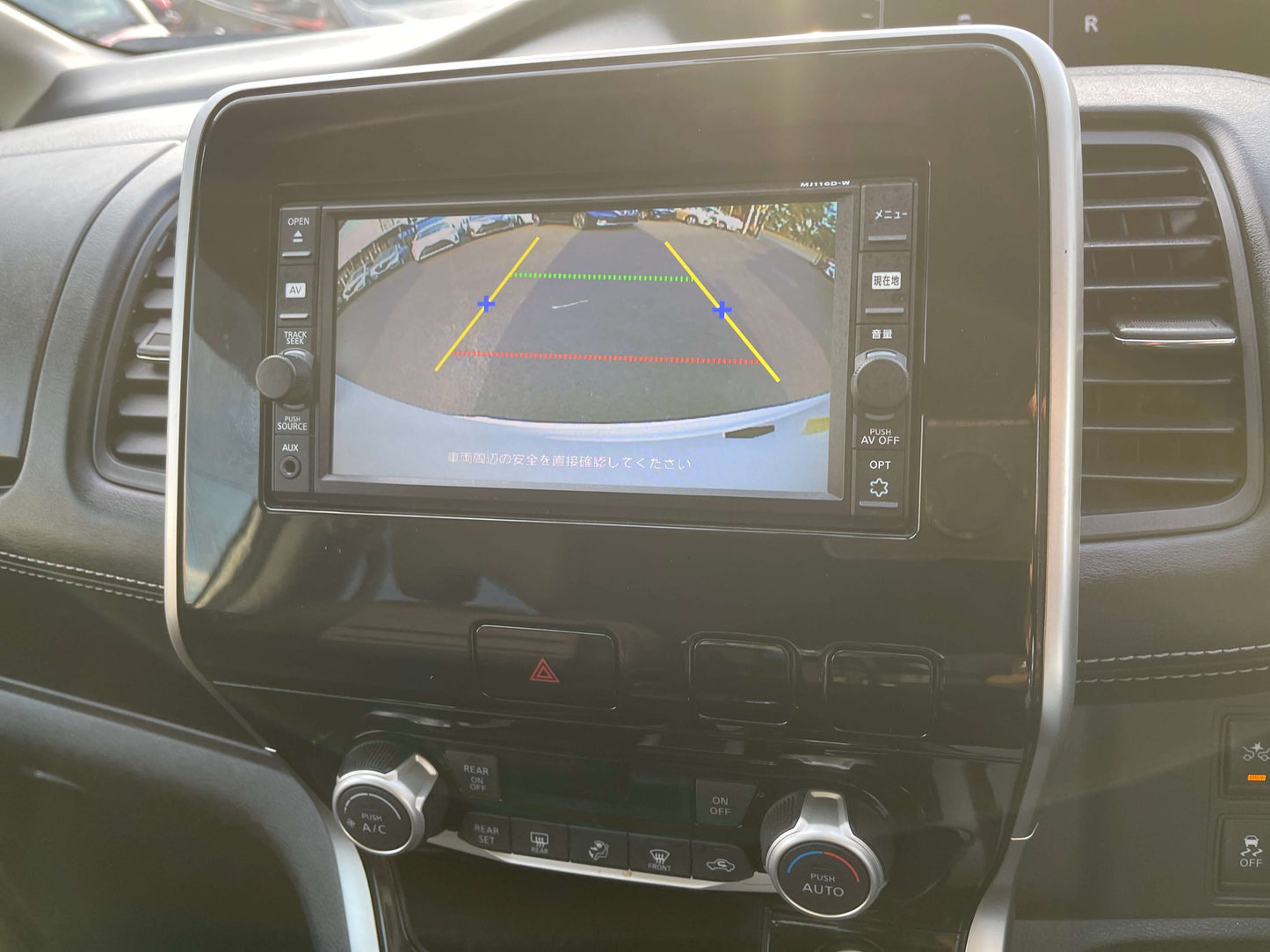 Rearview camera display in a 2016 Nissan Serena 2.0L S-Hybrid, showcasing parking guidelines.