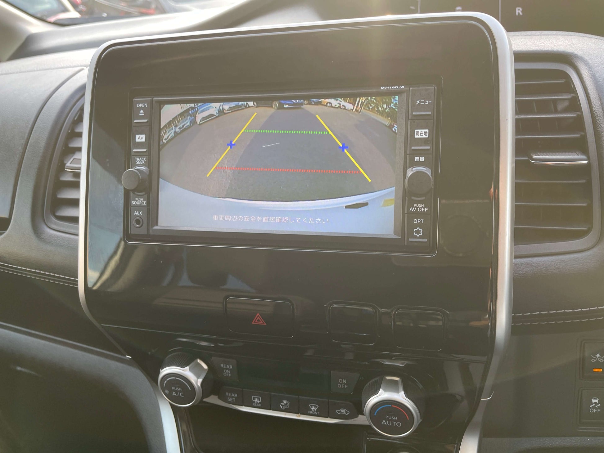Rearview camera display in a 2016 Nissan Serena 2.0L S-Hybrid, showcasing parking guidelines.