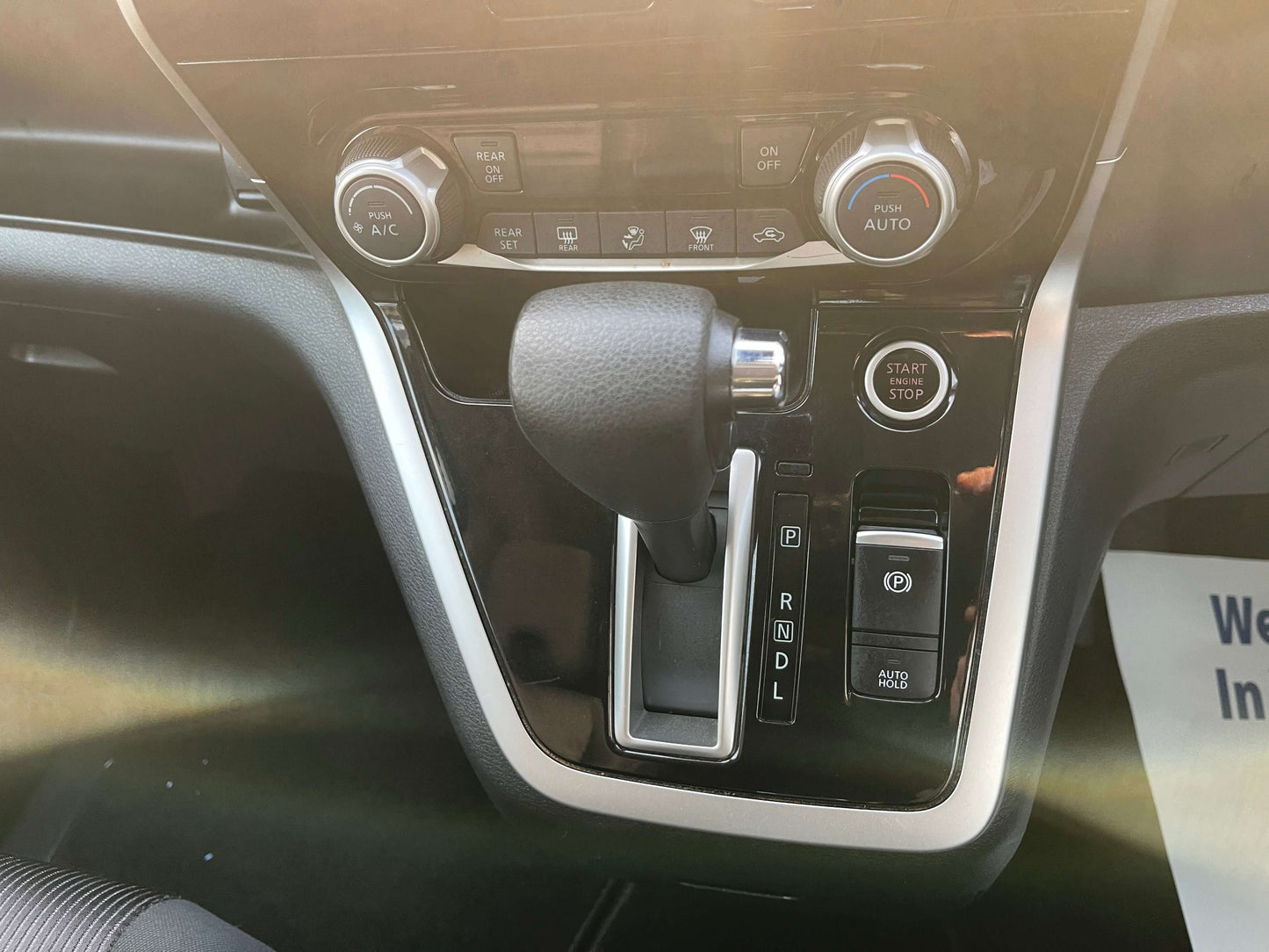 Interior view of the 2016 Nissan Serena 2.0L S-Hybrid showing gear shift and control panel details.
