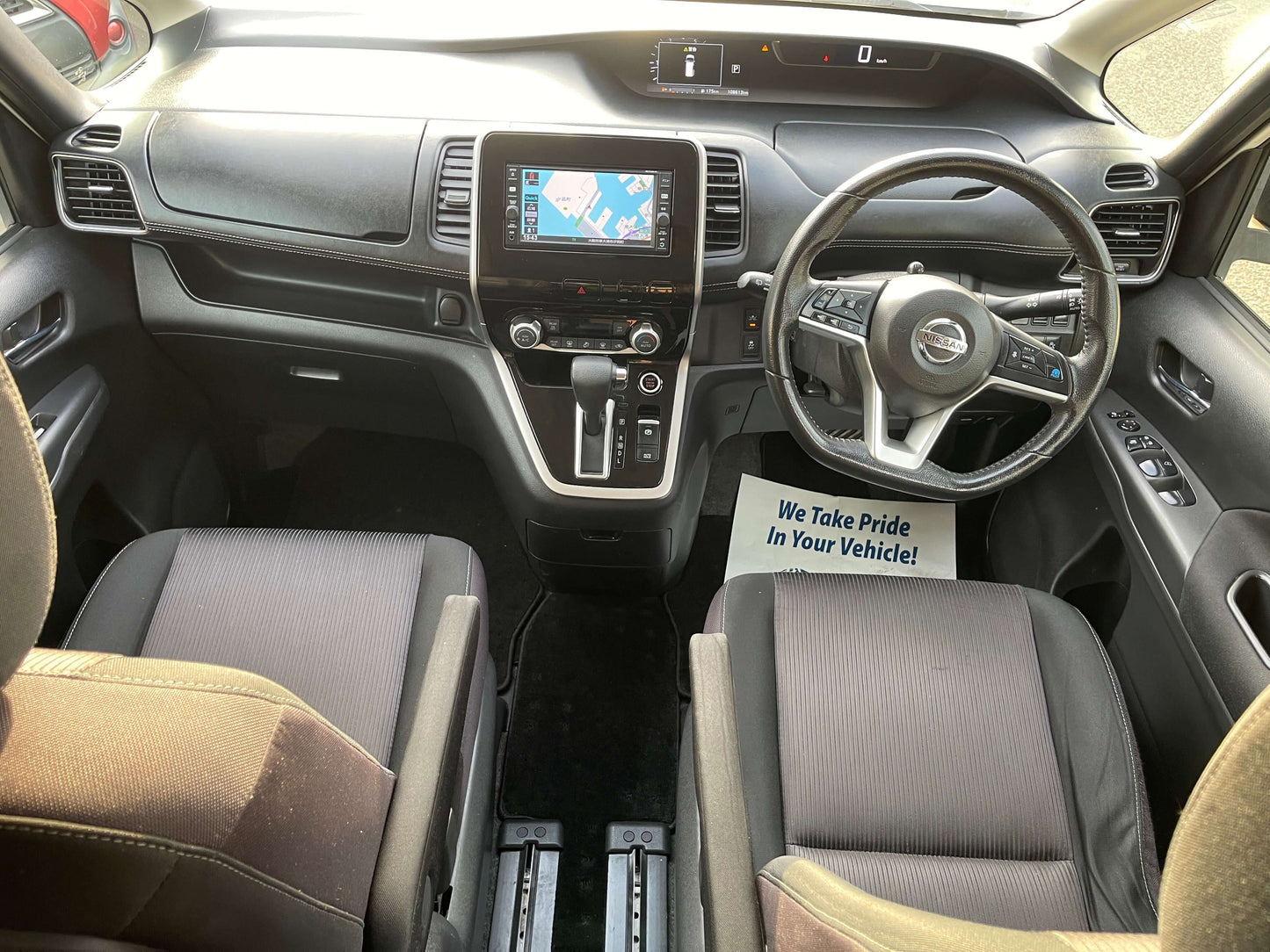 Interior view of the 2016 Nissan Serena 2.0L S-Hybrid with modern dashboard and seating arrangement.