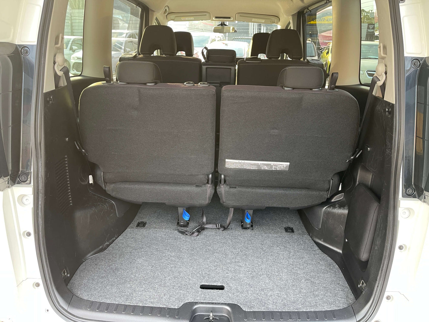 Interior view of the 2016 Nissan Serena 2.0L S-Hybrid showing 8 seats and spacious cargo area.