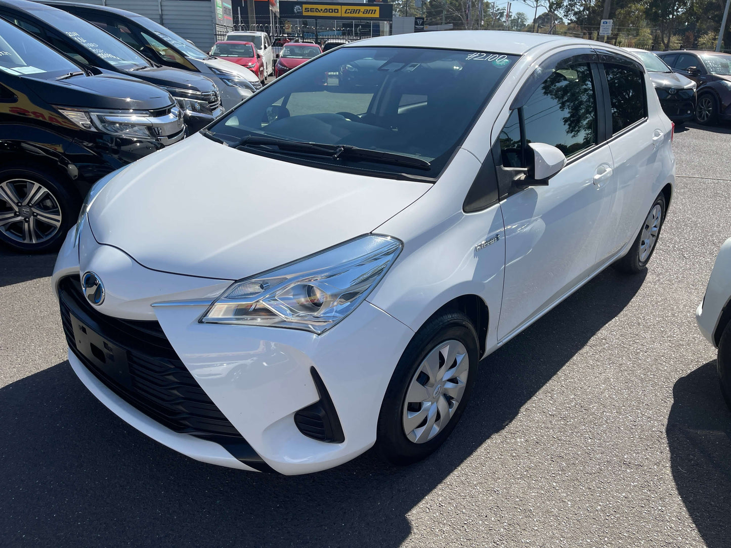 2020 Toyota Vitz 1.5L Hybrid F Safety Edition parked in a dealership lot, showcasing its sleek design.