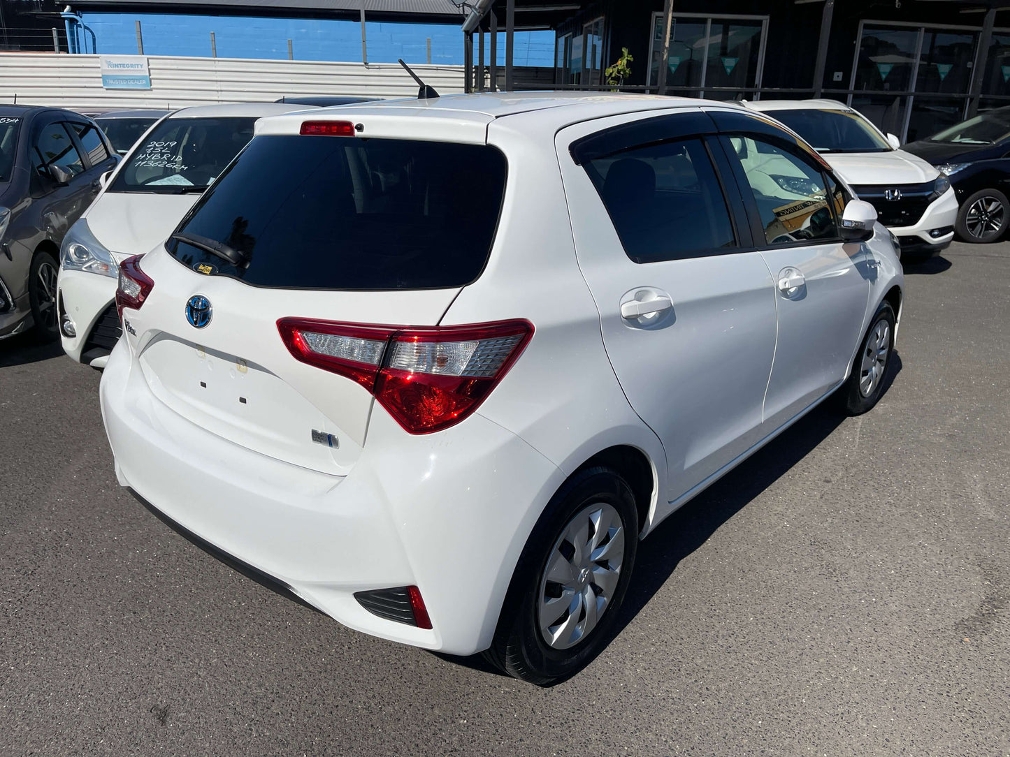 2020 Toyota Vitz 1.5L Hybrid F Safety Edition in white, showcasing rear view and modern design features.