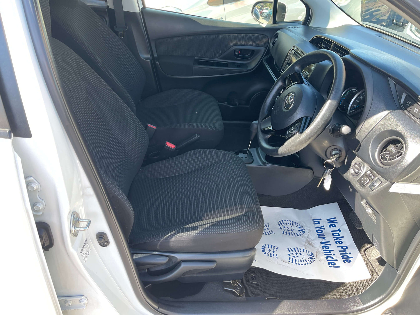 Interior view of a 2020 Toyota Vitz 1.5L Hybrid F Safety Edition showcasing seats and dashboard.