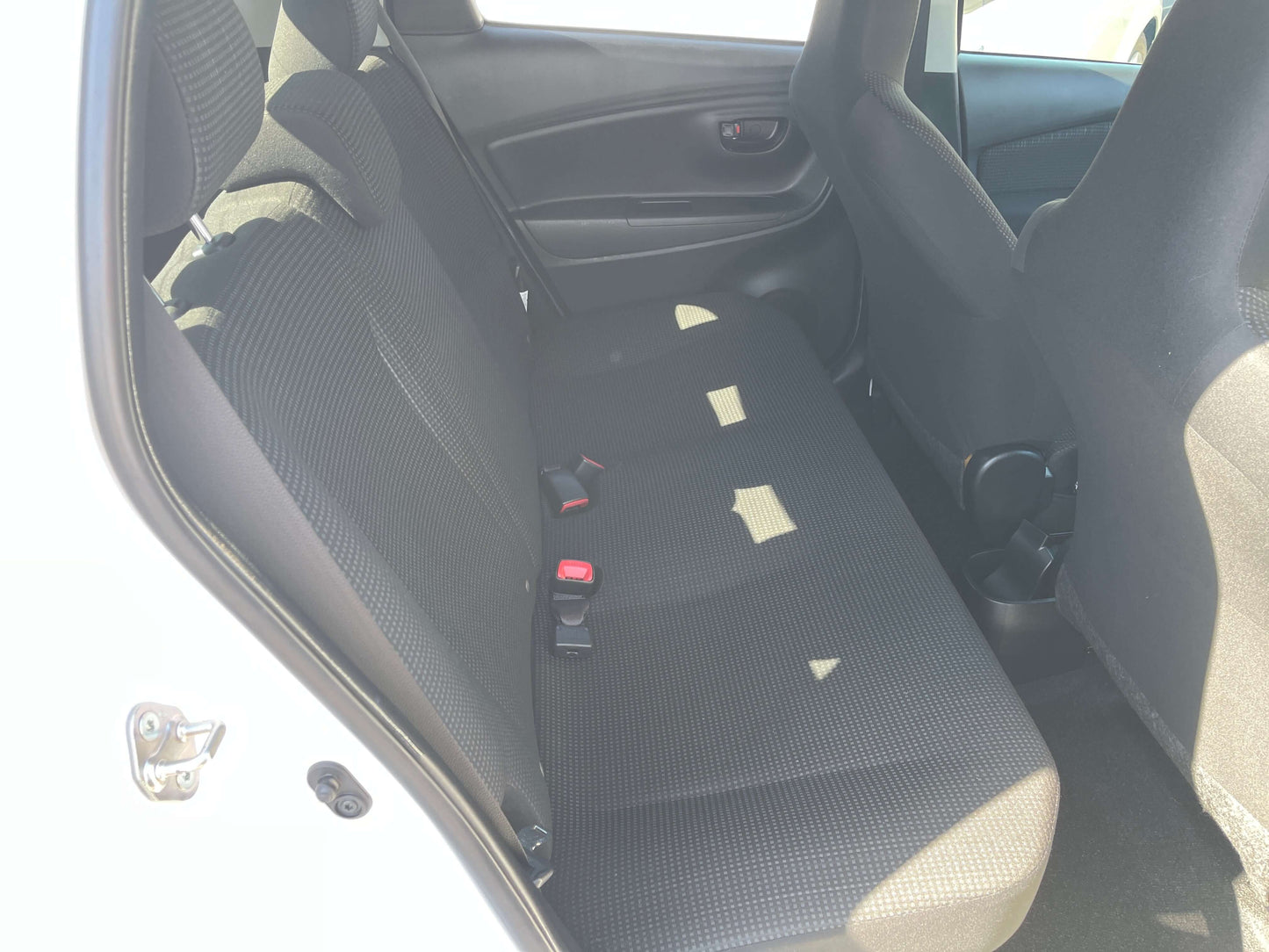 Interior view of the backseat in a 2020 Toyota Vitz 1.5L Hybrid F Safety Edition.