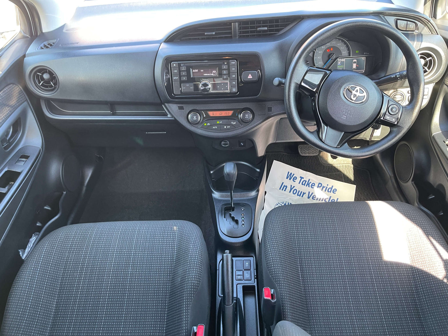 Interior view of a 2020 Toyota Vitz 1.5L Hybrid F Safety Edition showcasing dashboard and front seats.