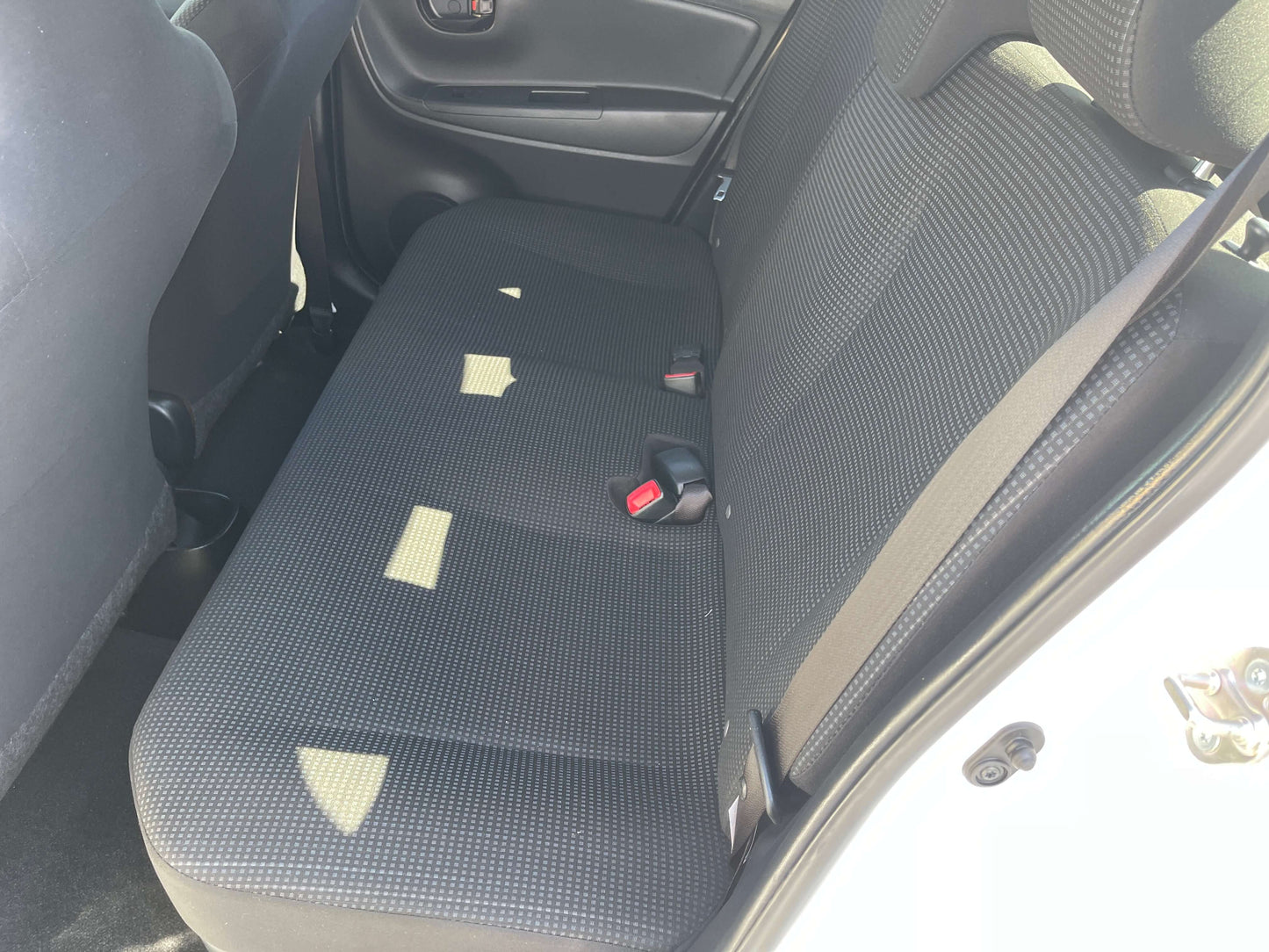 Back seat of the 2020 Toyota Vitz 1.5L Hybrid F Safety Edition showing fabric upholstery.