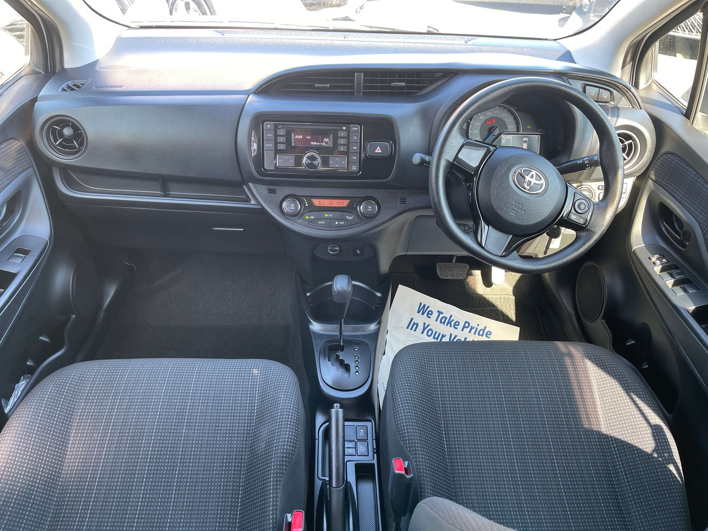 Interior view of 2020 Toyota Vitz 1.5L Hybrid F Safety Edition with modern dashboard and comfortable seating.
