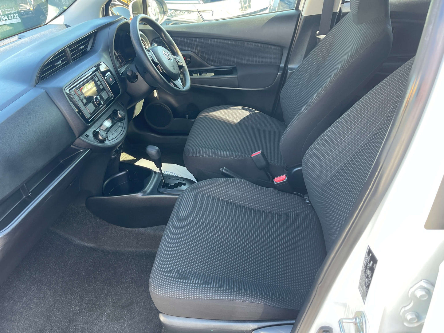 Interior view of the 2020 Toyota Vitz 1.5L Hybrid F Safety Edition showcasing the seats and dashboard.