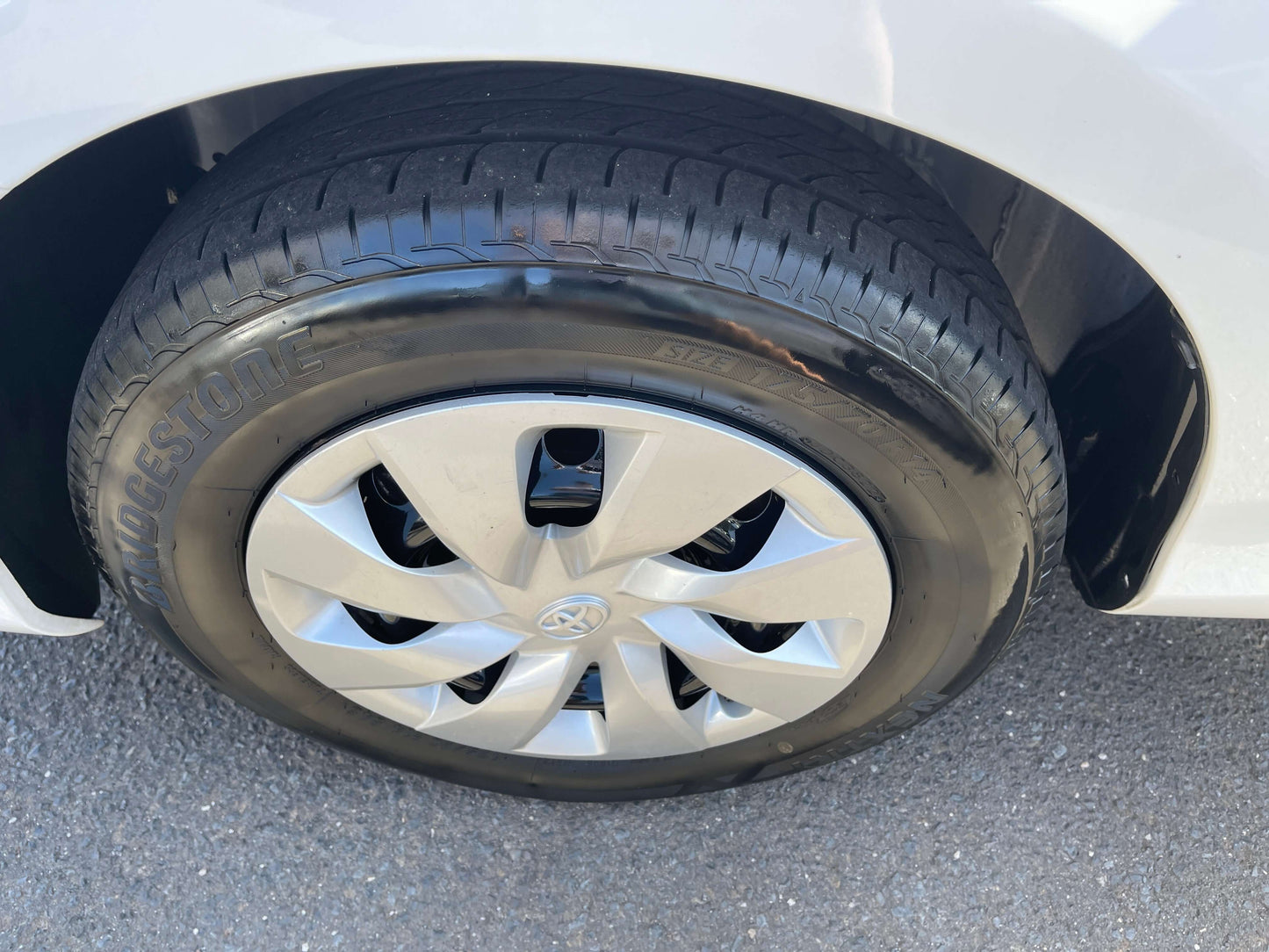 Close-up of a 2020 Toyota Vitz 1.5L Hybrid F Safety Edition wheel and tire, featuring Bridgestone tires.