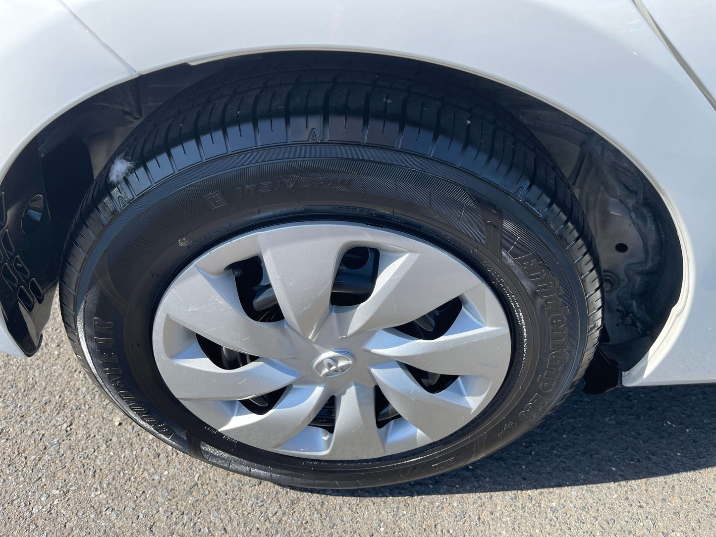 Close-up view of the wheel of a 2020 Toyota Vitz 1.5L Hybrid, showcasing the tire and rim design.