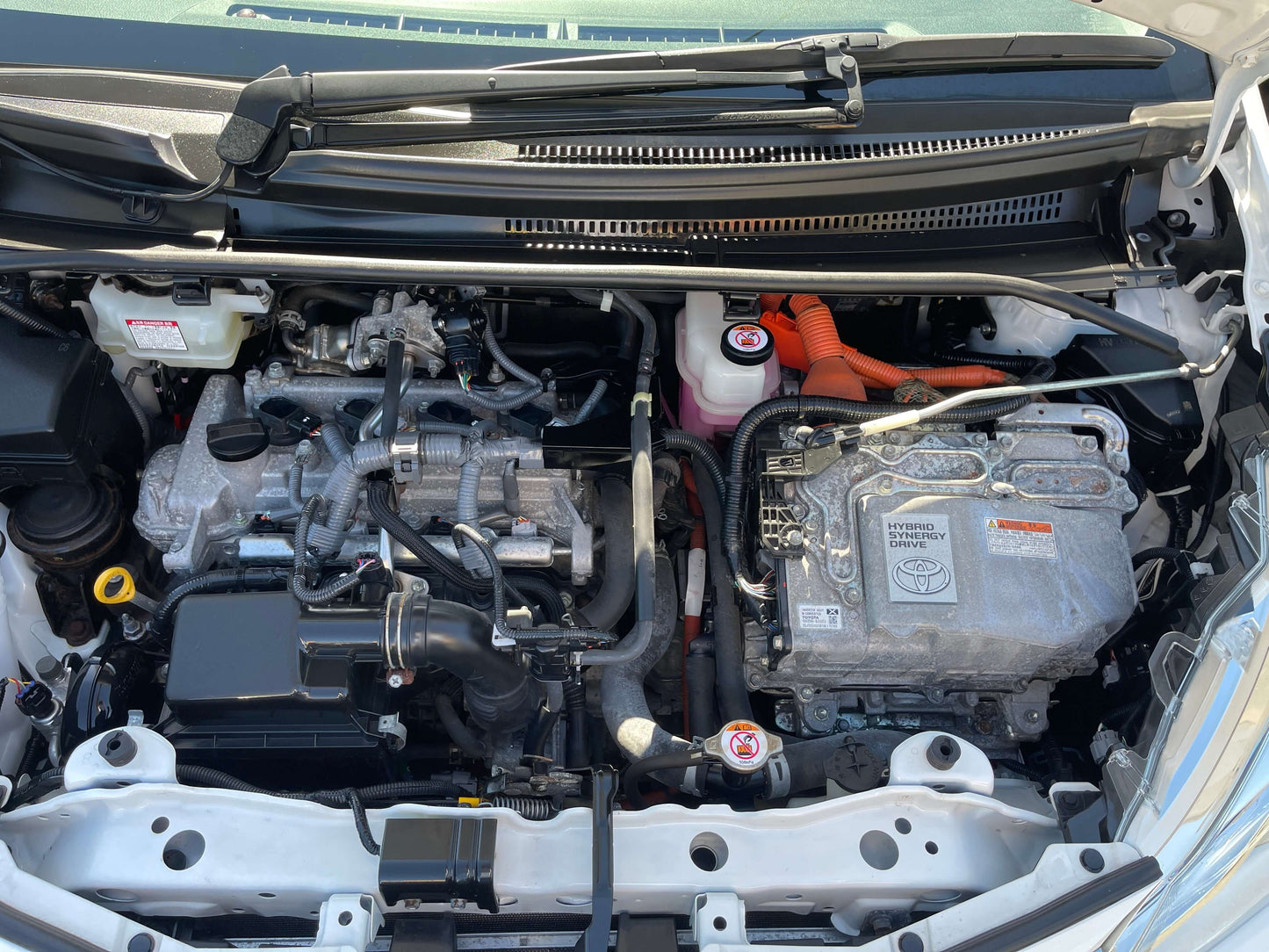 2020 Toyota Vitz 1.5L Hybrid engine compartment and components overview.