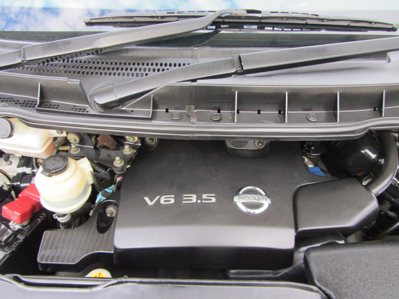 Engine bay of 2005 Nissan Elgrand V6 3.5L Rider Autech showing the V6 3.5 engine.