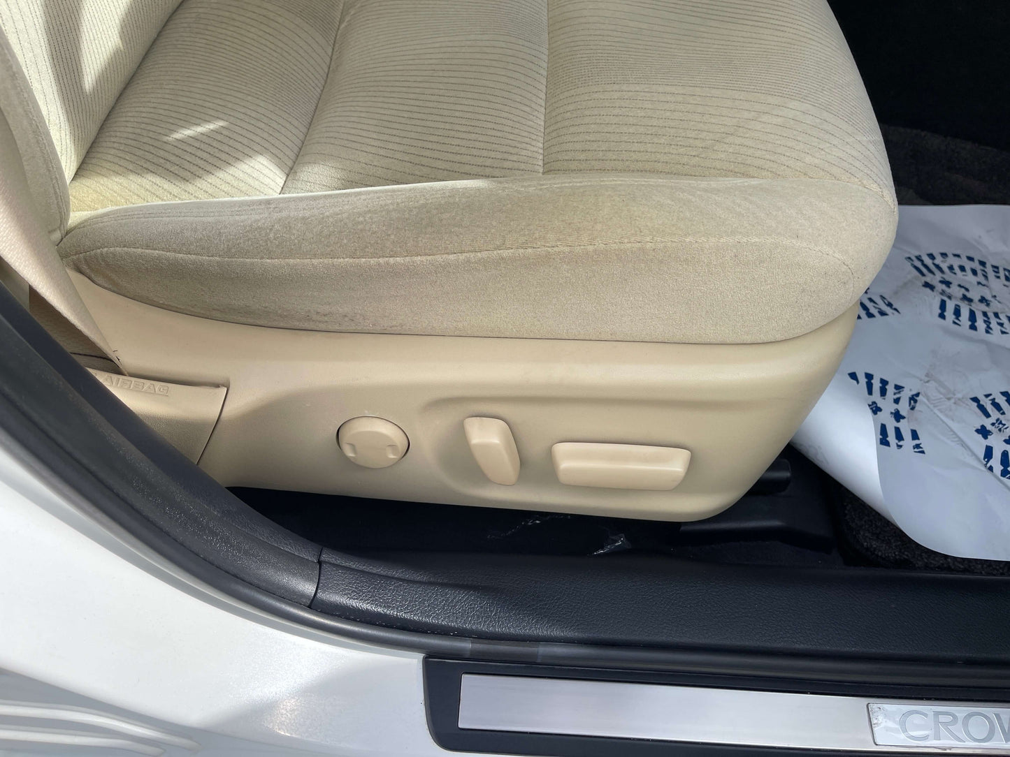 Interior view of 2014 Toyota Crown Majesta V6 3.5L Hybrid luxury sedan seat adjustment controls.