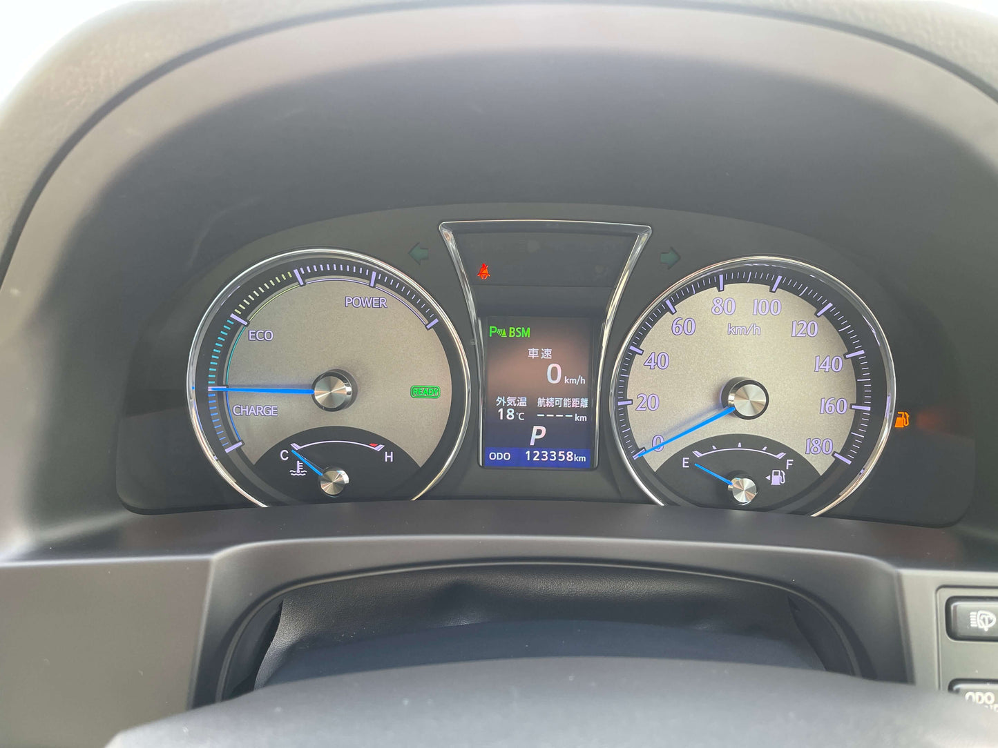 Dashboard display of a 2014 Toyota Crown Majesta V6 3.5L Hybrid showing speed and fuel metrics.