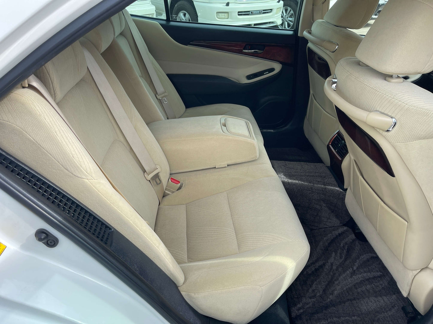 Interior view of the rear seating area in the 2014 Toyota Crown Majesta V6 3.5L Hybrid Luxury Sedan.