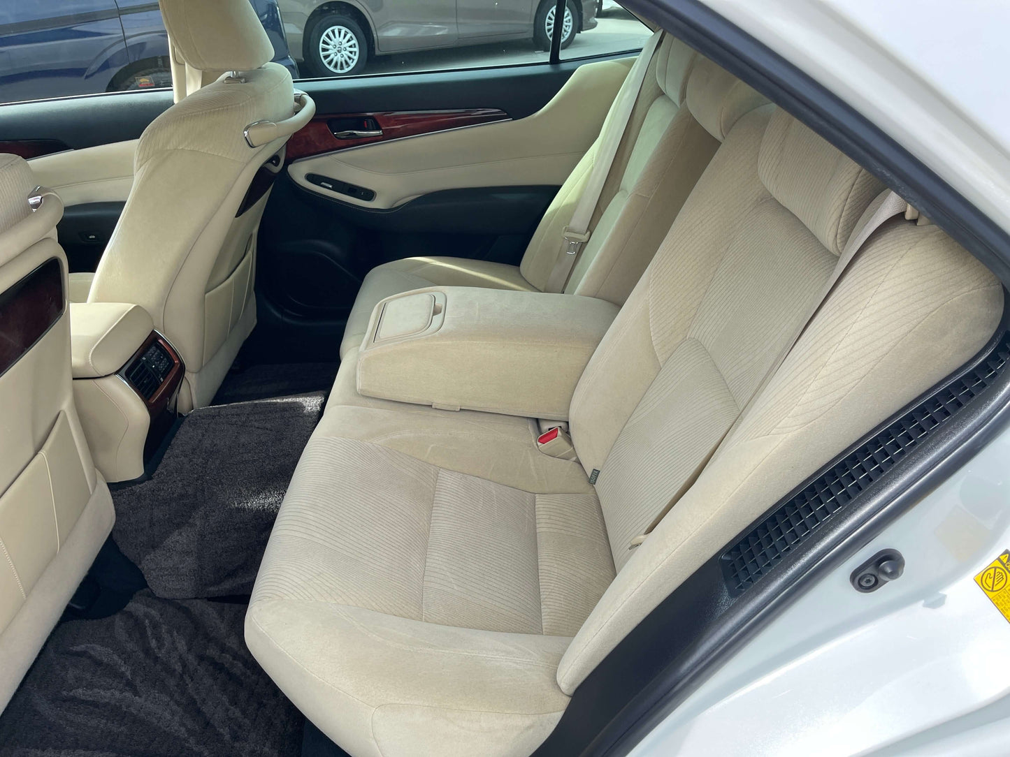 Interior view of the spacious backseat of a 2014 Toyota Crown Majesta V6 3.5L Hybrid Luxury Sedan.