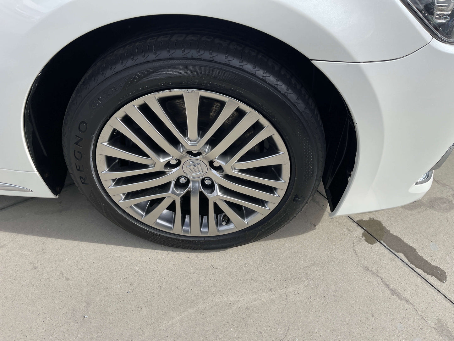 Close-up of the alloy wheel of a 2014 Toyota Crown Majesta V6 3.5L Hybrid luxury sedan.