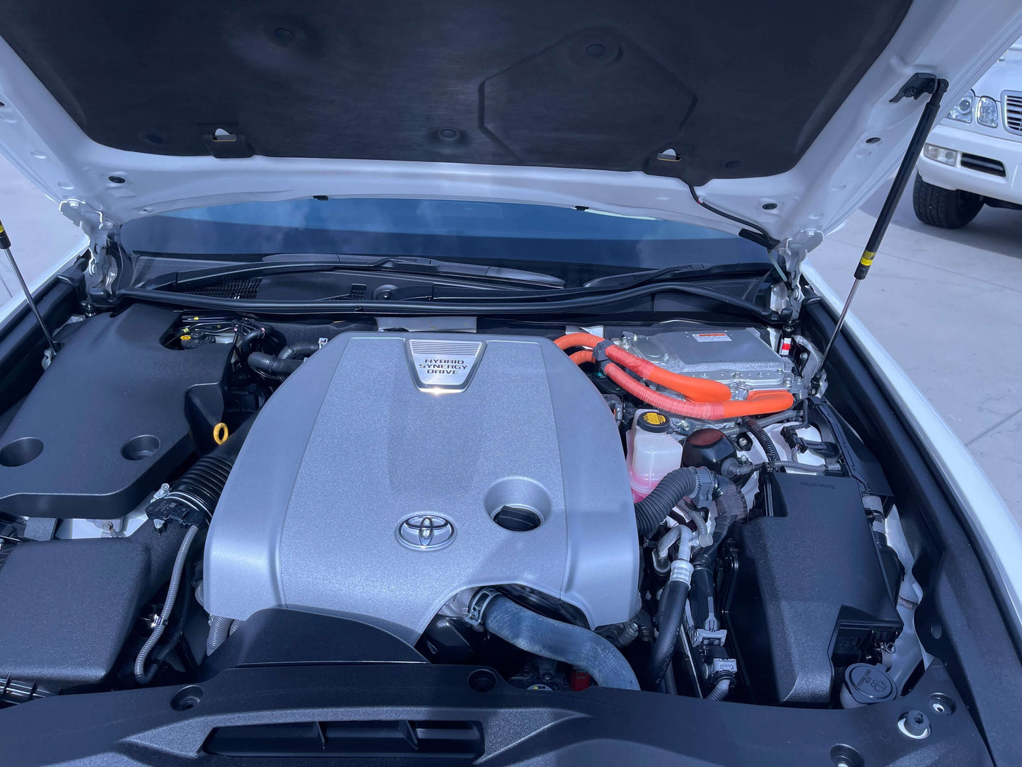 Engine compartment of a 2014 Toyota Crown Majesta V6 3.5L Hybrid Luxury Sedan, showcasing the hybrid power system.