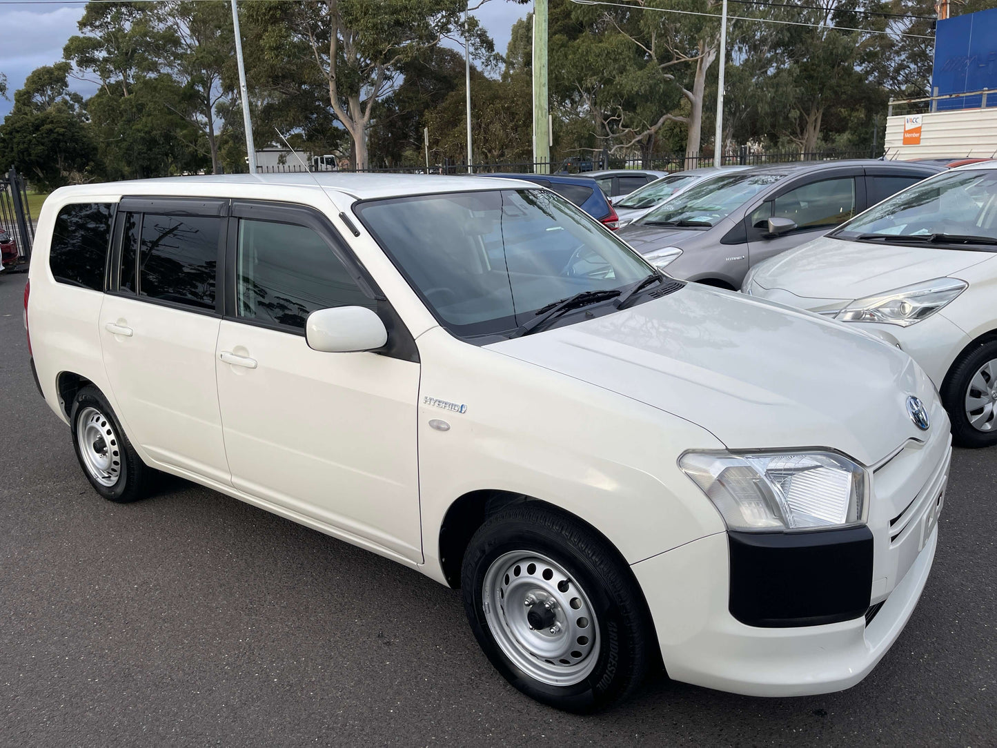 2020 Toyota Probox Hybrid 1.5L Station Wagon in white color parked among other vehicles.