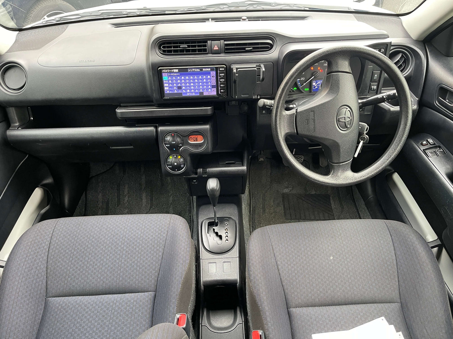 Interior view of the 2020 Toyota Probox Hybrid 1.5L Station Wagon showcasing the dashboard and seating.