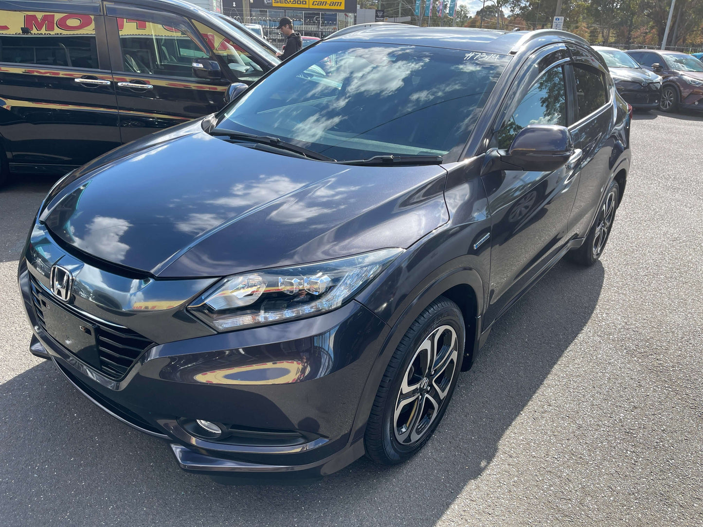 2014 Honda Vezel HR-V Hybrid SUV in sleek black color, showcasing stylish design and modern features.