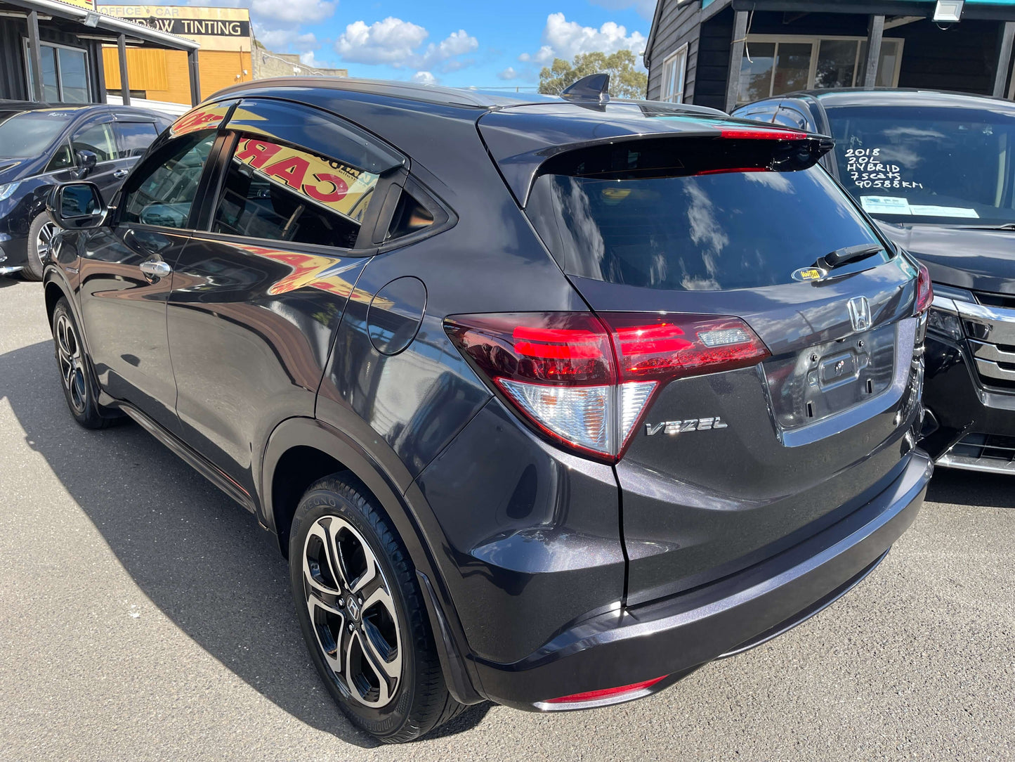 2014 Honda Vezel HR-V Hybrid Z SUV rear view showcasing sleek design and sporty features.