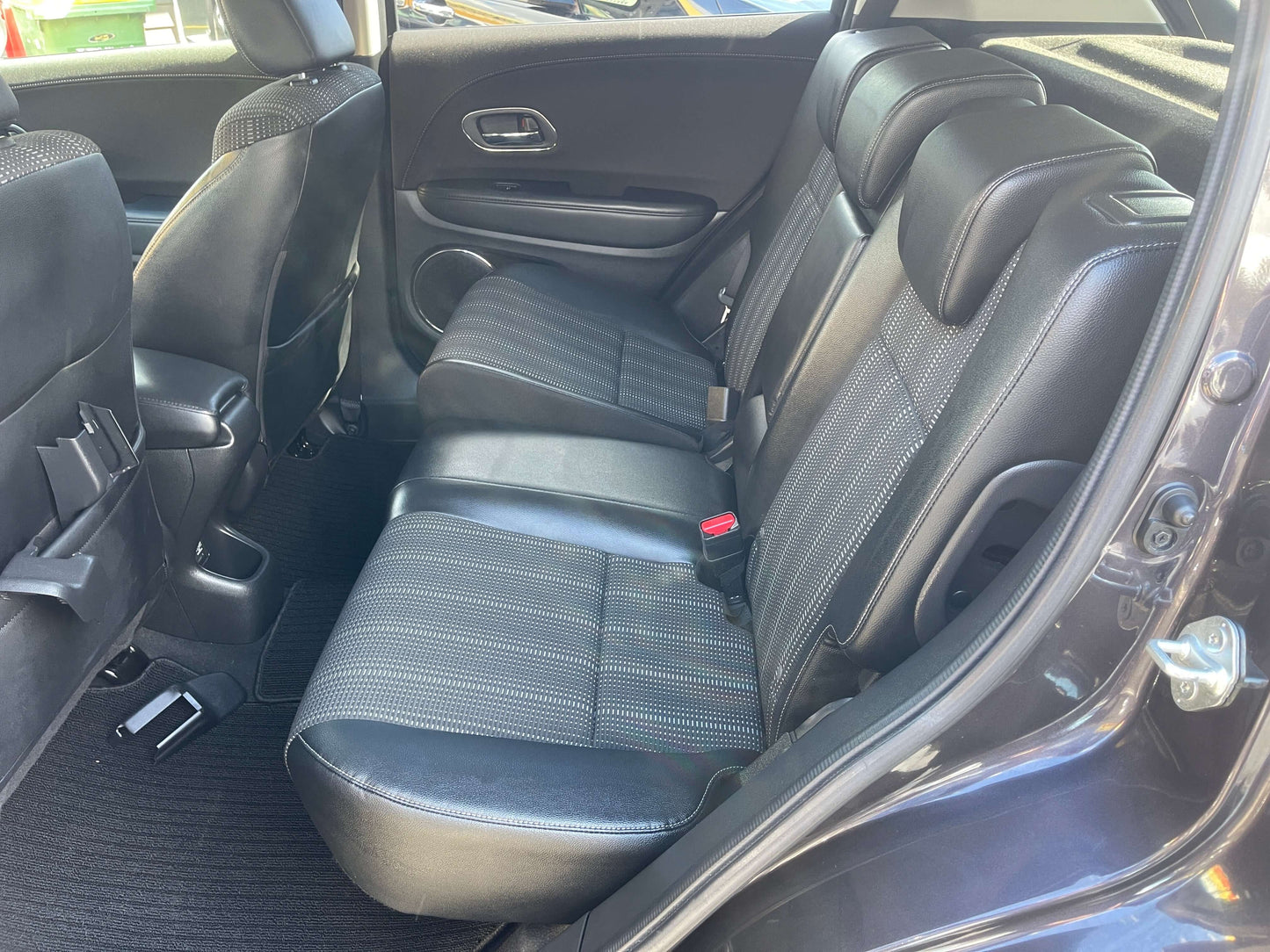 Rear interior view of the 2014 Honda Vezel HR-V Hybrid SUV 5-seater with comfortable leather seating.