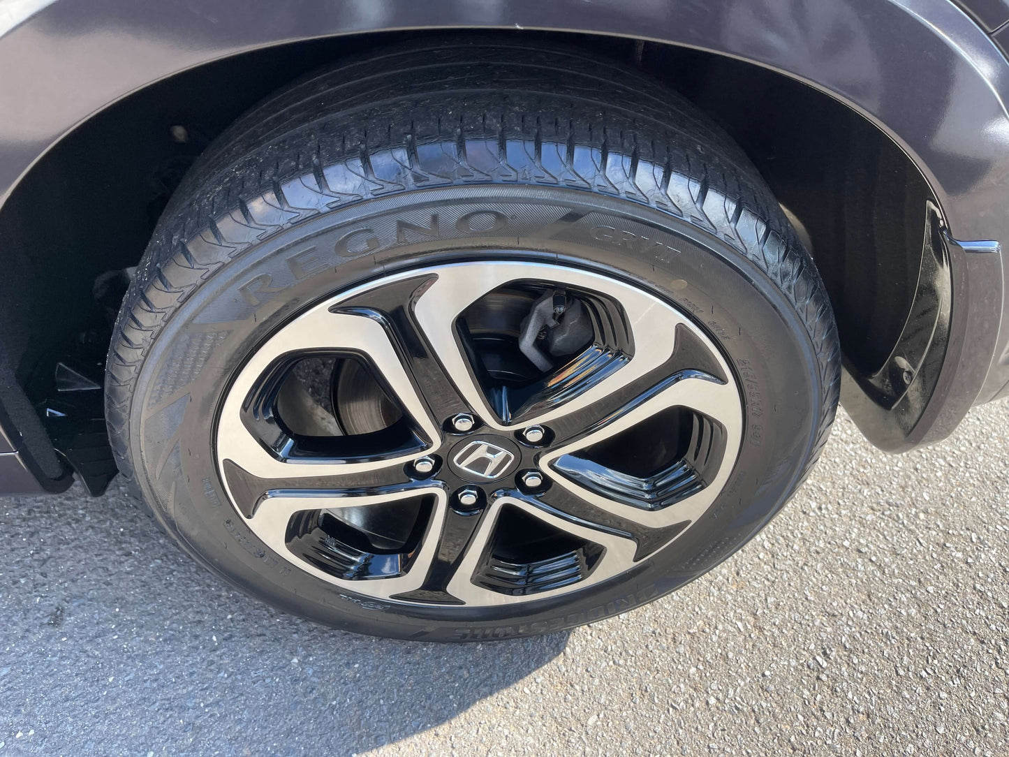 Close-up of the stylish alloy wheel on the 2014 Honda Vezel HR-V Hybrid, showcasing its sleek design.