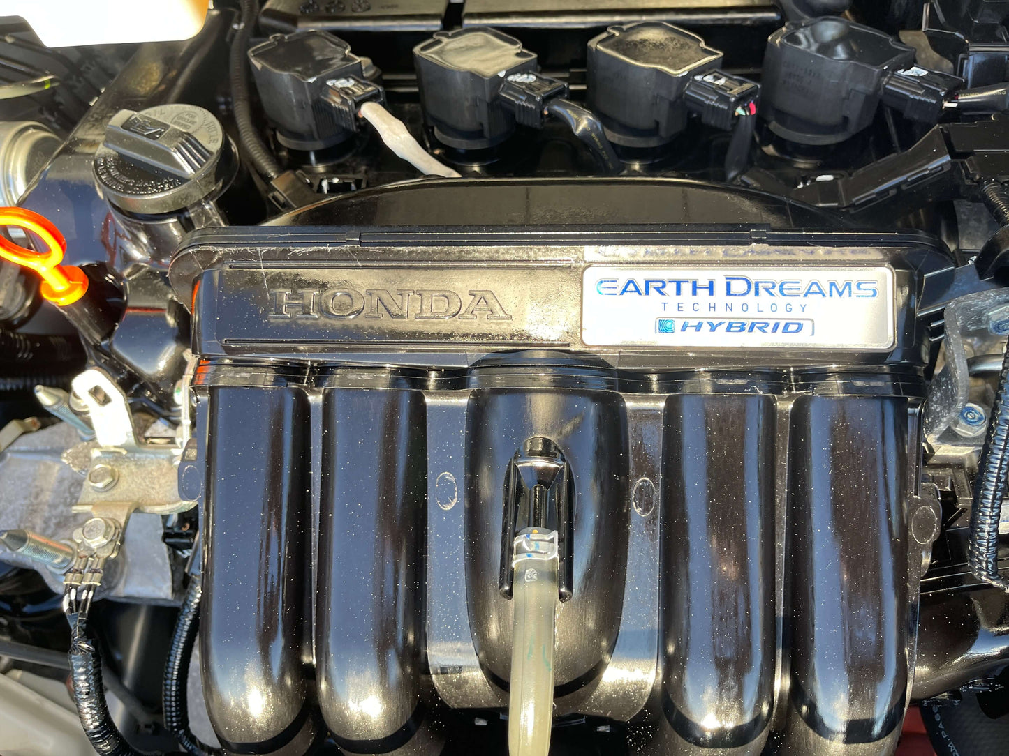 2016 Honda Grace 1.5 Hybrid engine with Earth Dreams Technology, showcasing fuel-efficient hybrid design.