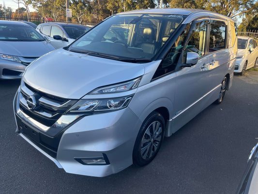 2016 Nissan Serena 2.0L S-Hybrid parked in a lot, showcasing its sleek silver design and modern features.