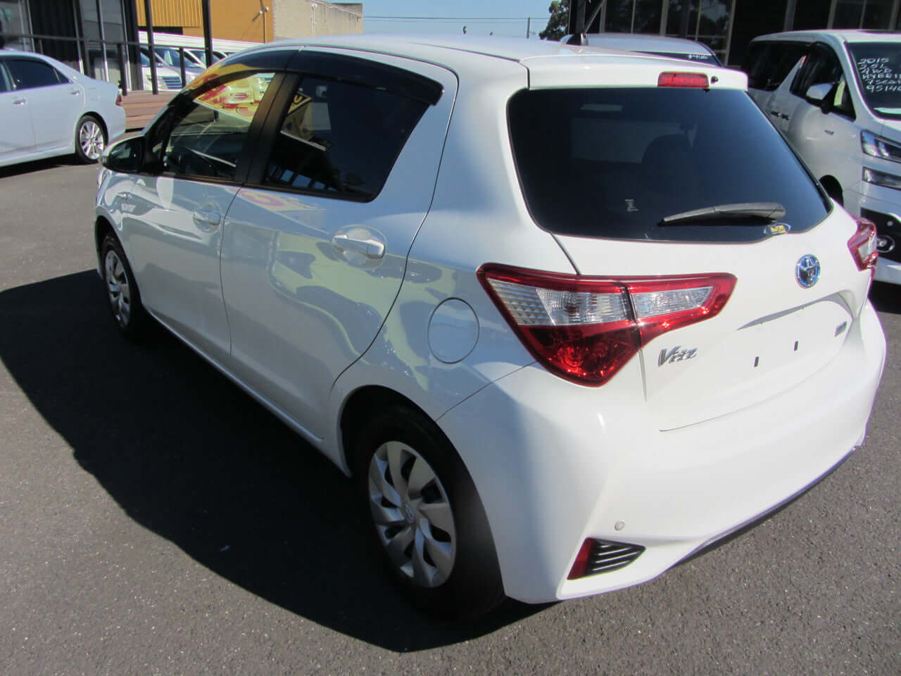 2018 Toyota Vitz 1.5L Hybrid parked, showcasing rear and side view, VIN 6ZZJNHP1302037251, mileage 96590 km