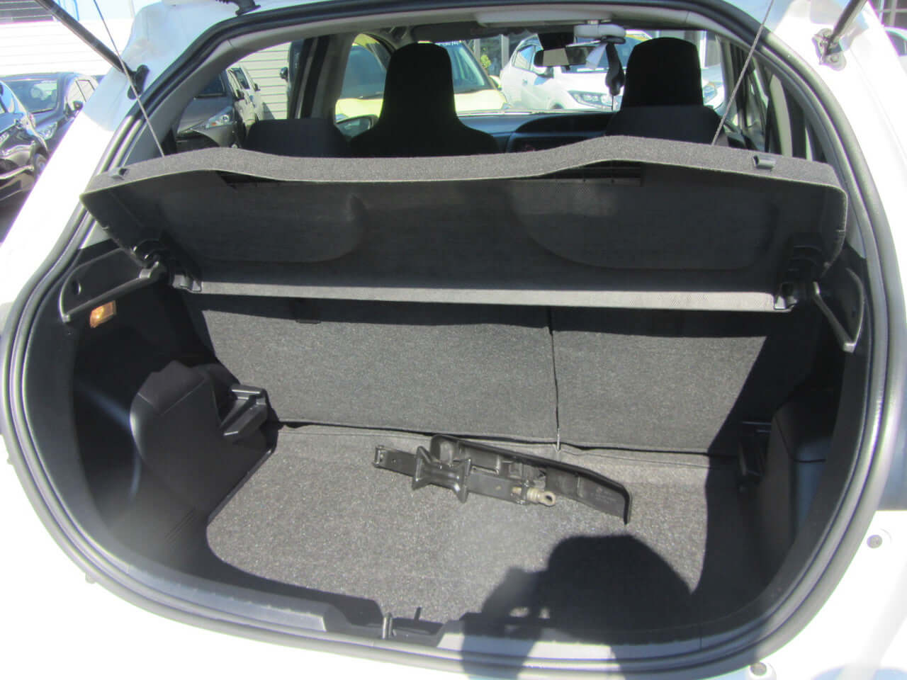 2018 Toyota Vitz 1.5L Hybrid trunk space interior showing cargo area and storage features.